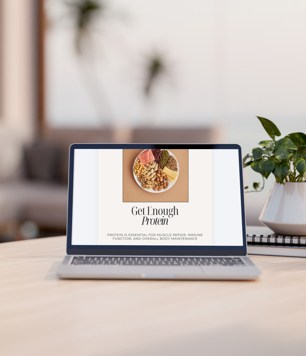 A laptop computer mockup on a wooden table in a luxurious contemporary living room with a sea view.
